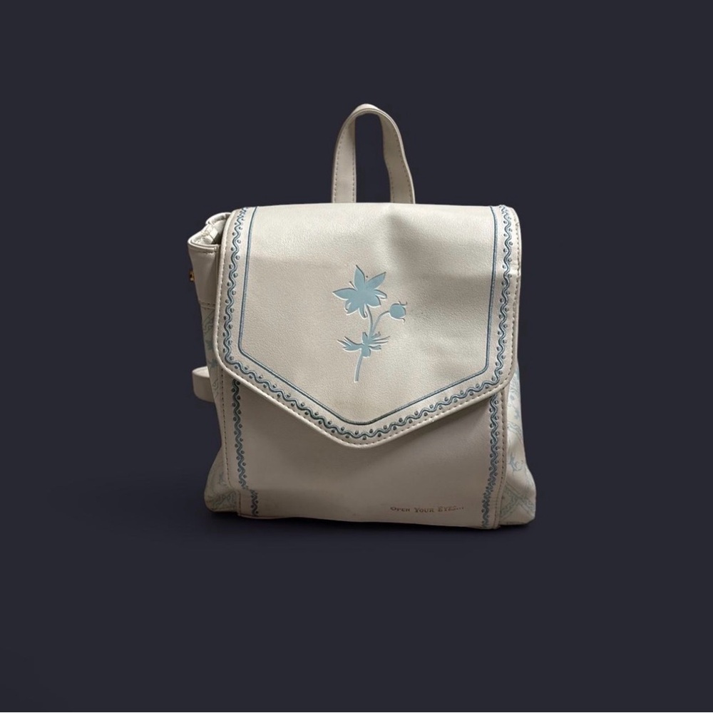 Danielle Nicole Cream Backpack with Blue Floral Accent